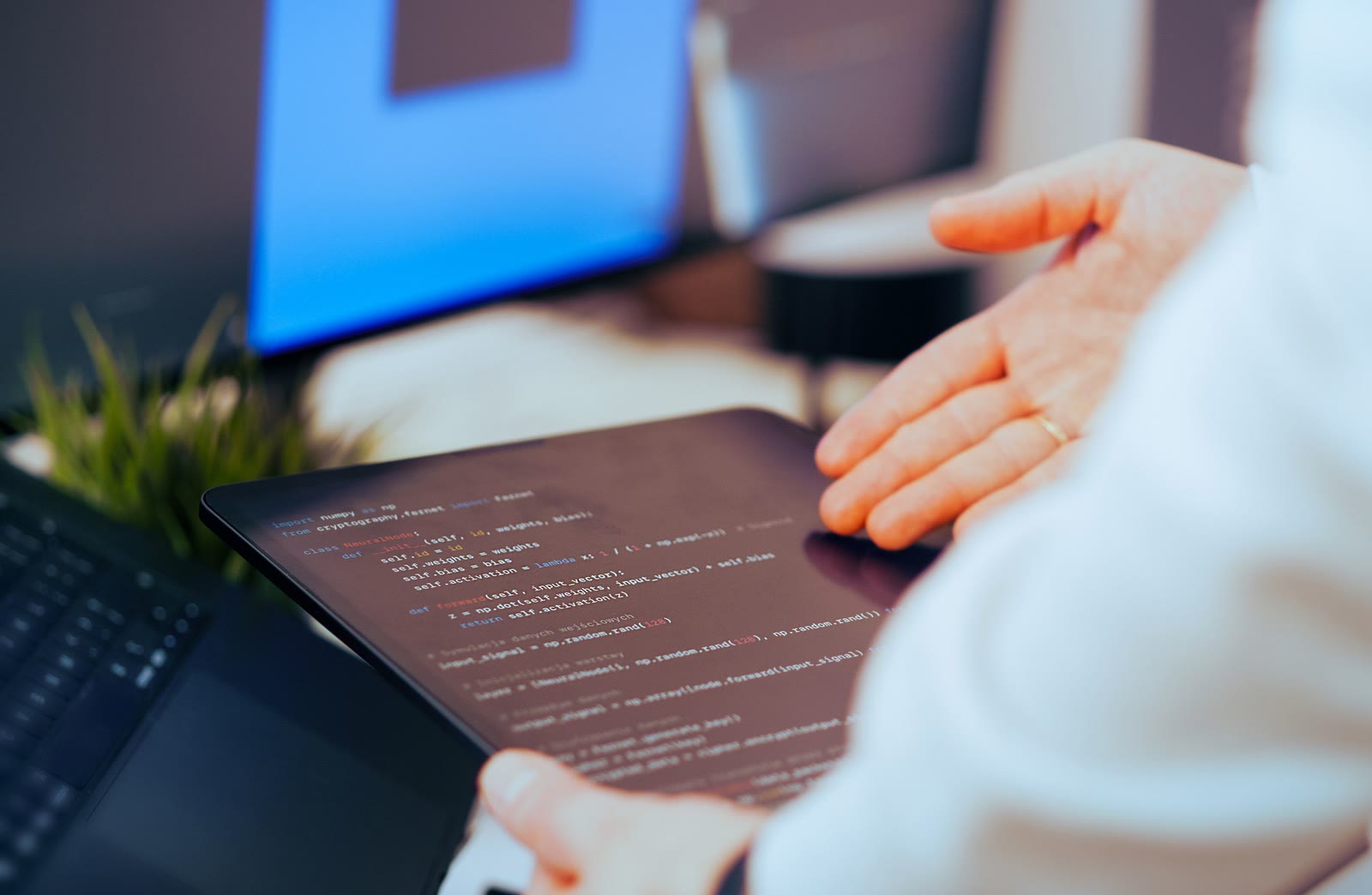 Developer reviewing code on a tablet for secure access design