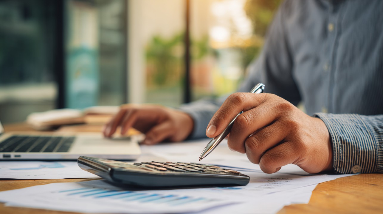 Finance professional reviewing digital records and reports