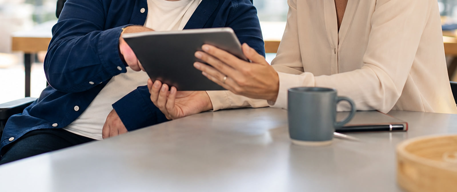 Tablet-based service records being reviewed during an NDIS workflow